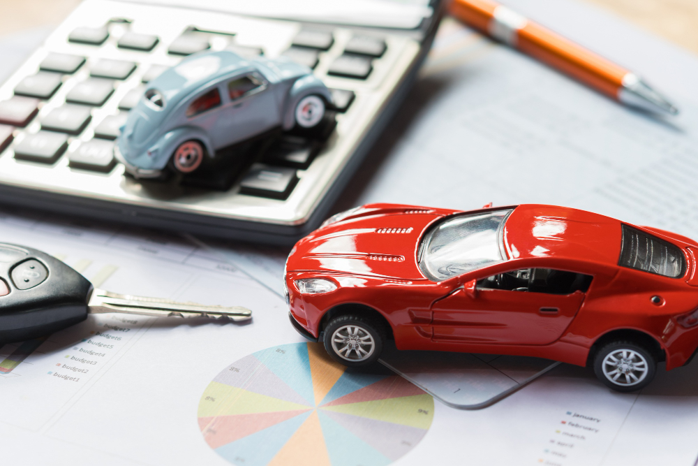 Car toy and calculator with key. business finance and insurance concept idea